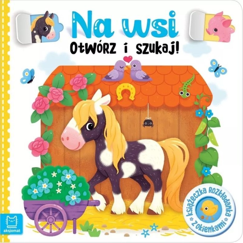 Książka dla dzieci „Na Wsi – Otwórz i Szukaj!” z ilustracją konika przy stajni i kolorowych roślin.
